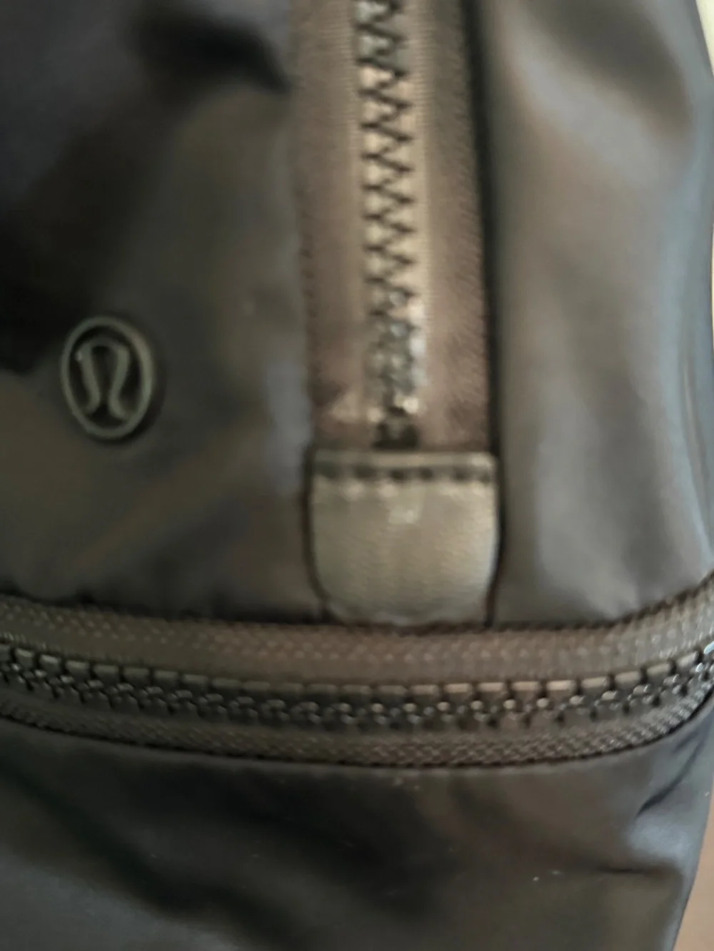 Lululemon Backpack Black On Black Shoulder Straps Zip Close Mesh Compartments